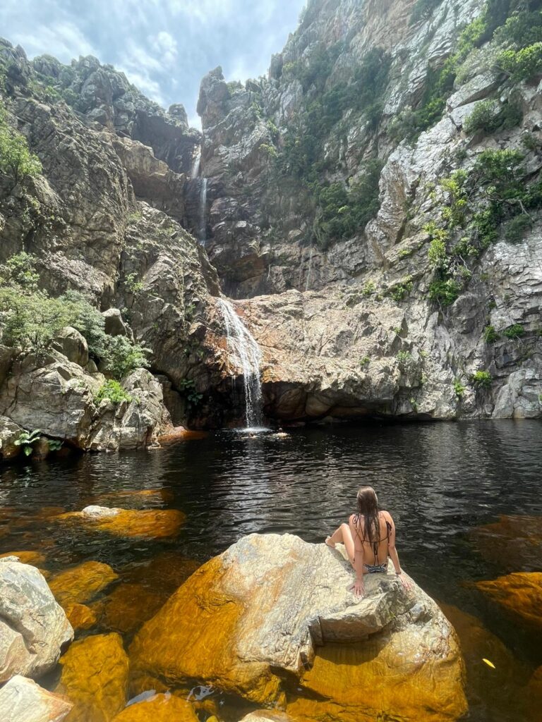 Swimming in the natural rock pools on the Crystal Pools waterfall hike near Cape Town