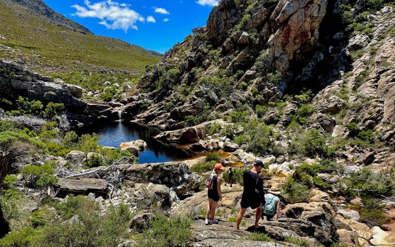 Hikers walking along the fynbos trail to Crystal Pools near Gordon’s Bay